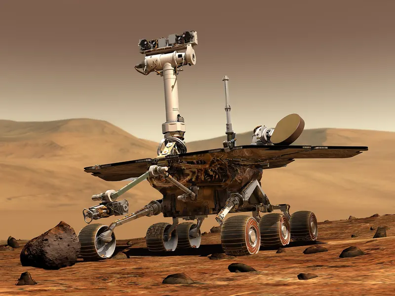 An illustration of a six-wheeled rover with solar panels on a rocky Martian surface