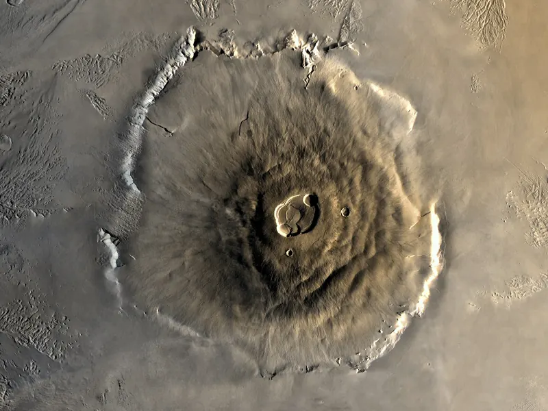A huge, wide volcano with a crater at its top, seen from above